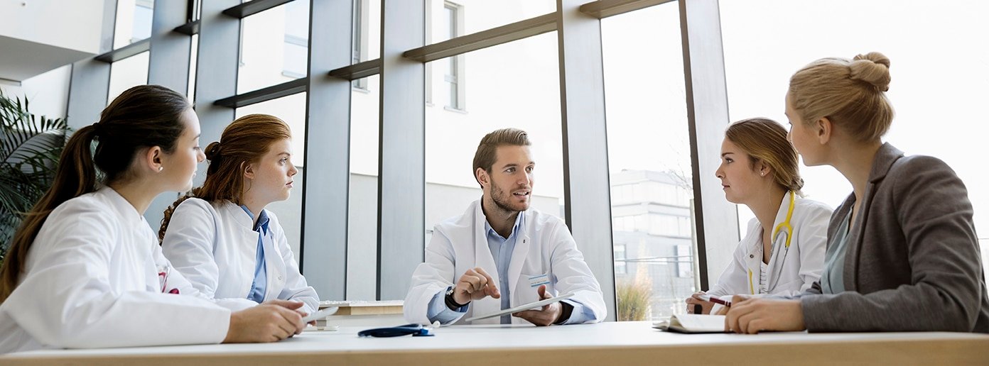 Group of doctors in meeting with consultant
